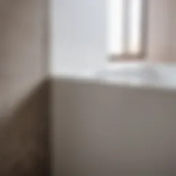 Close-up of a well-finished gap between a bathtub and wall highlighting precision