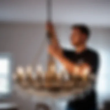 Effective Techniques for Chandelier Disassembly Person demonstrating careful chandelier disassembly