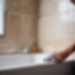 Close-up of a caulking application between bathtub and tile