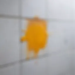 A close-up of silicone residue on a bathroom tile
