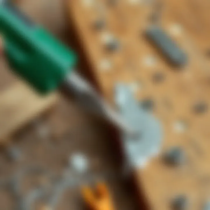 Mechanical Method for Adhesive Removal Scraping adhesive from metal using a tool