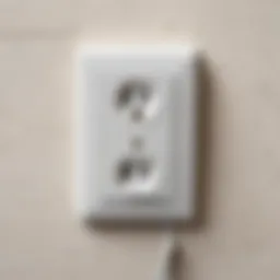 Close-up view of a standard electrical outlet with detailed specifications