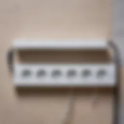 Wall-mounted power strip installation